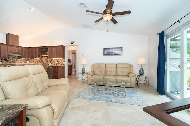 tiled living room featuring ceiling fan and lofted ceiling