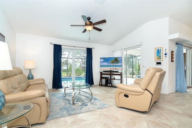 living room featuring ceiling fan and lofted ceiling