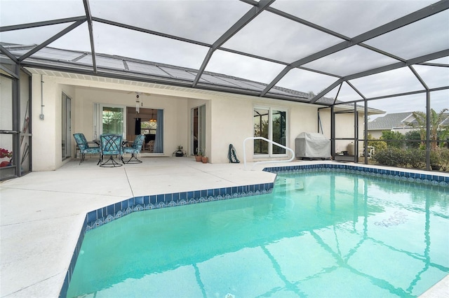 view of pool with a lanai and a patio area