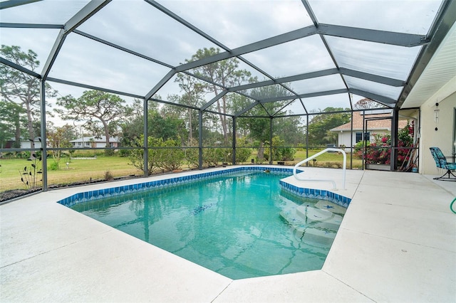 view of swimming pool with a lanai, a lawn, and a patio