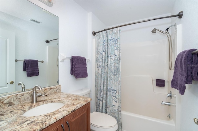 full bathroom with toilet, vanity, and shower / bath combo with shower curtain