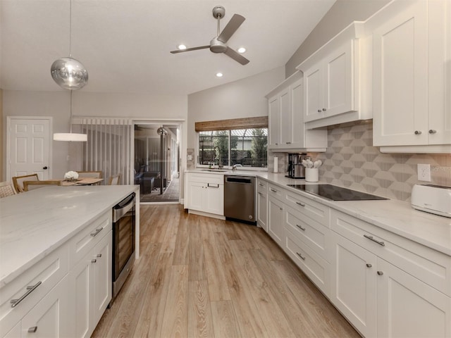 kitchen with dishwasher, decorative light fixtures, white cabinetry, black electric stovetop, and tasteful backsplash