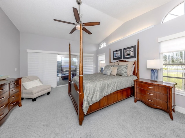 bedroom with light colored carpet, vaulted ceiling, ceiling fan, and access to outside