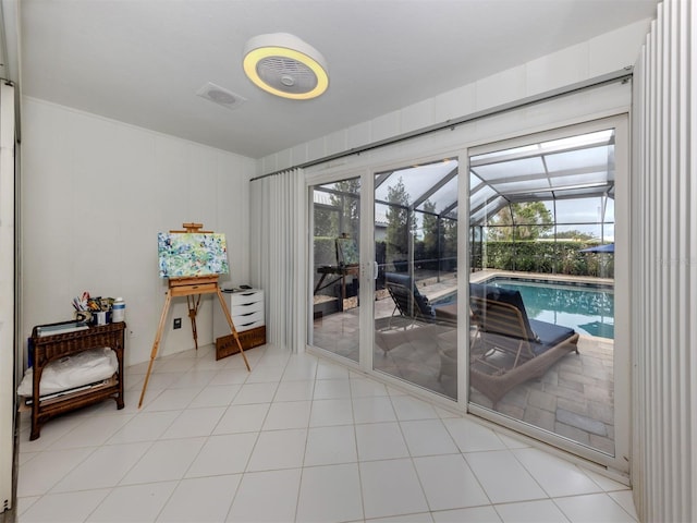 entryway with a healthy amount of sunlight and tile patterned floors