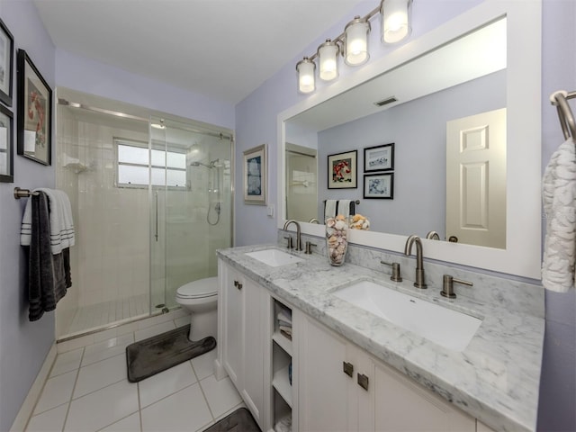 bathroom with a shower with door, toilet, tile patterned flooring, and vanity