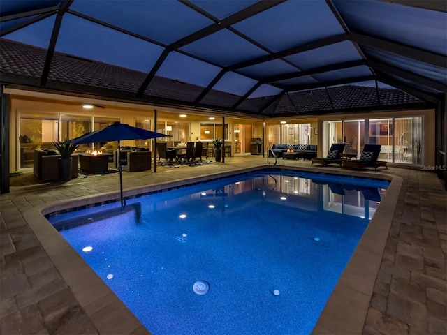 view of pool featuring a lanai and a patio