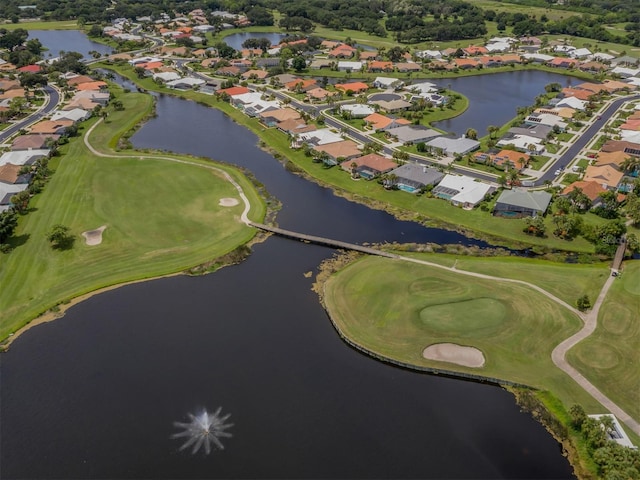 bird's eye view with view of golf course, a water view, and a residential view