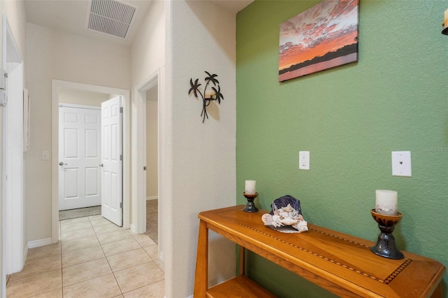 corridor featuring light tile patterned floors