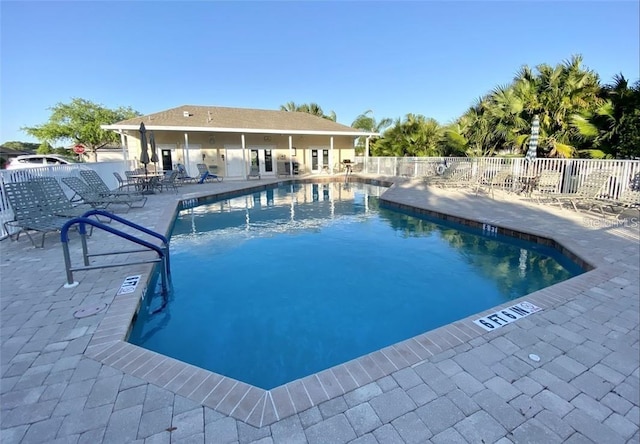 view of swimming pool with a patio