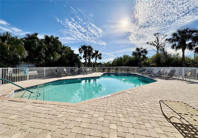 view of swimming pool with a patio area