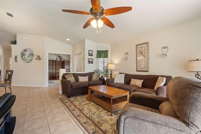 tiled living room with lofted ceiling and ceiling fan