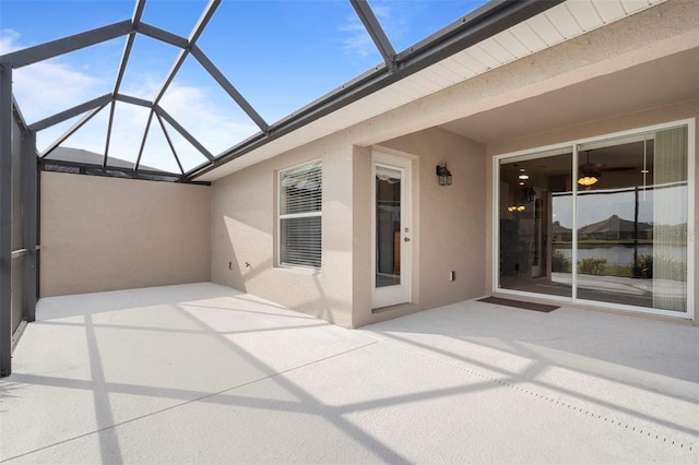 view of patio with a lanai