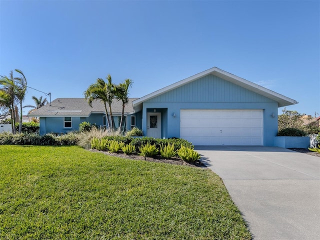 ranch-style home with a garage and a front yard