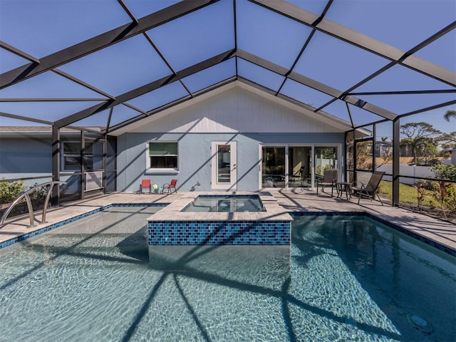 view of swimming pool with a lanai, a patio area, and an in ground hot tub