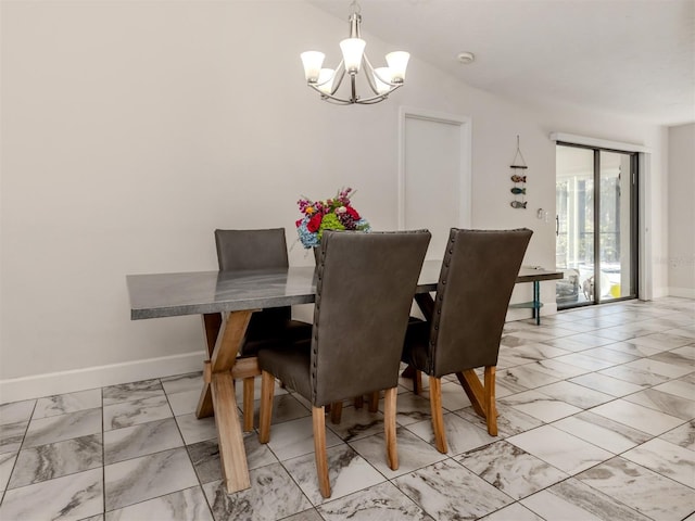 dining room with a notable chandelier and vaulted ceiling