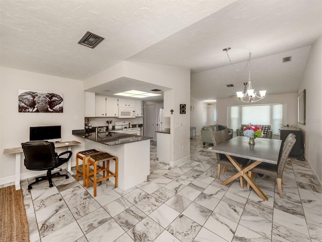 interior space featuring an inviting chandelier, sink, and a textured ceiling