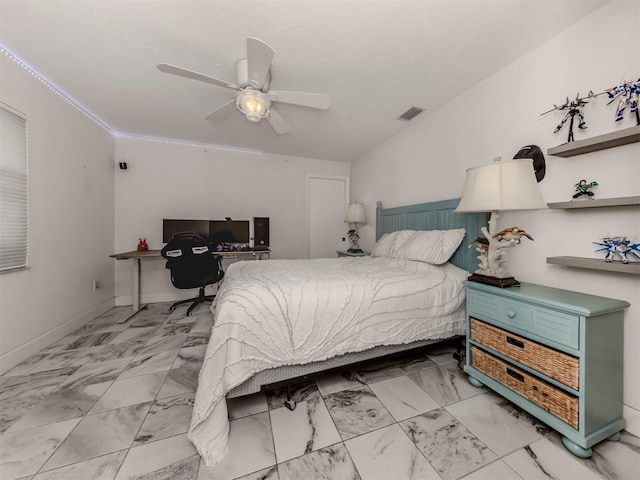 bedroom with ornamental molding and ceiling fan