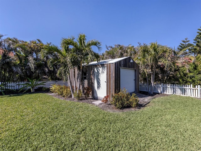 view of yard with a garage and an outdoor structure