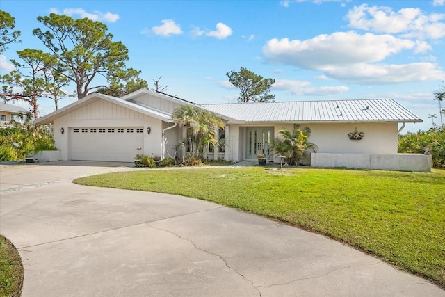 ranch-style house featuring a garage and a front yard