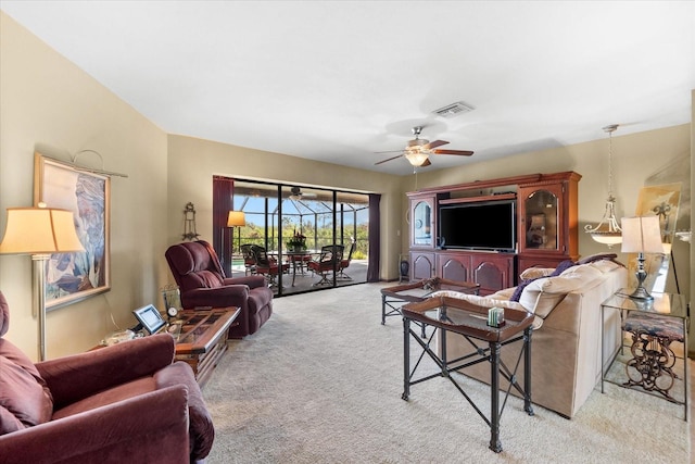 living room featuring ceiling fan and light carpet