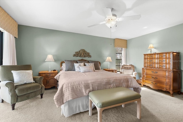 bedroom with light carpet and ceiling fan