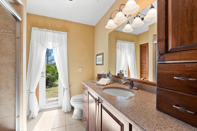 bathroom with walk in shower, vanity, toilet, and tile patterned flooring