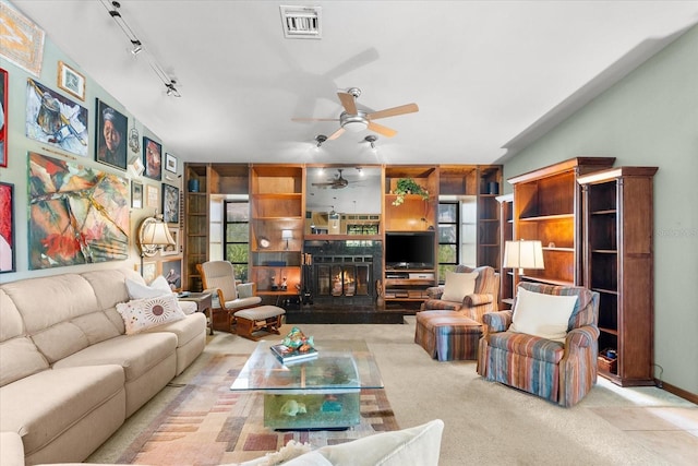 living room with ceiling fan, rail lighting, and light colored carpet