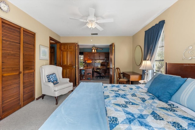 bedroom featuring ceiling fan, carpet flooring, and a closet