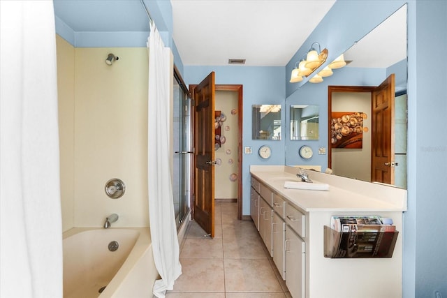 bathroom featuring vanity, tub / shower combination, and tile patterned flooring