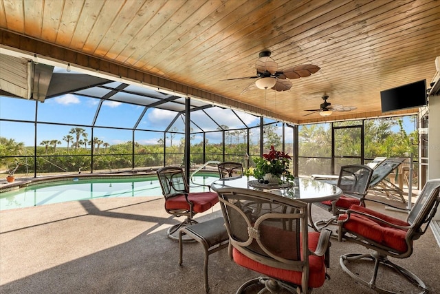 exterior space featuring ceiling fan, a lanai, and a patio