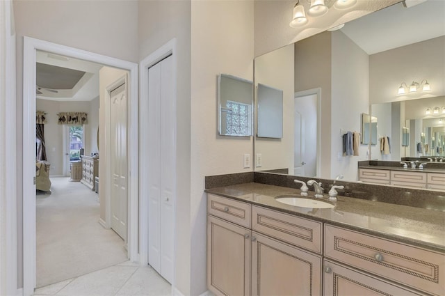 bathroom with tile patterned floors and vanity