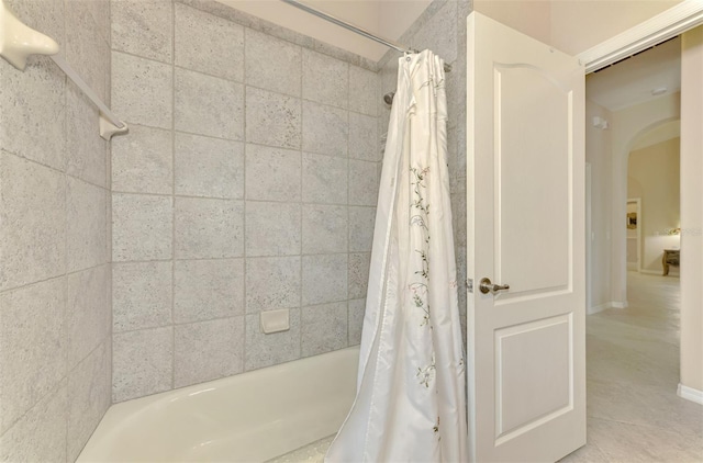 bathroom with shower / bathtub combination with curtain