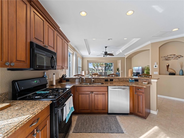 kitchen featuring black appliances, sink, ornamental molding, kitchen peninsula, and a raised ceiling