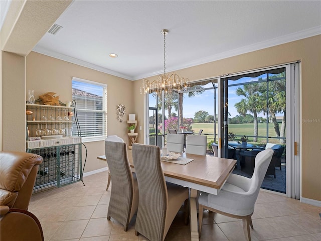 tiled dining room with an inviting chandelier and ornamental molding