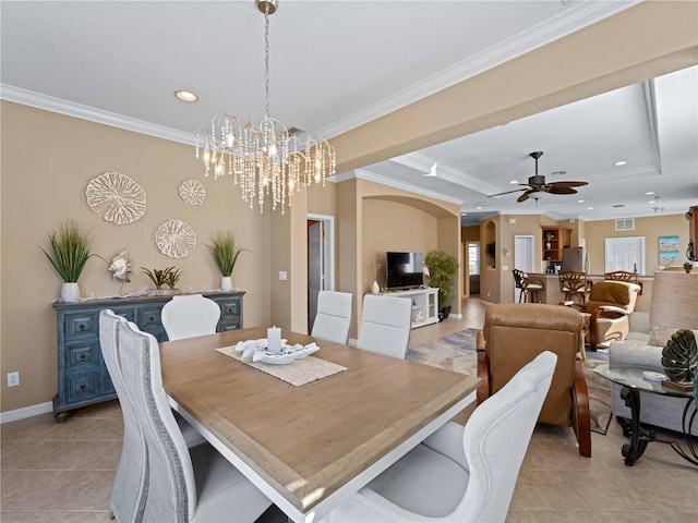 dining space featuring crown molding, ceiling fan with notable chandelier, and light tile patterned floors