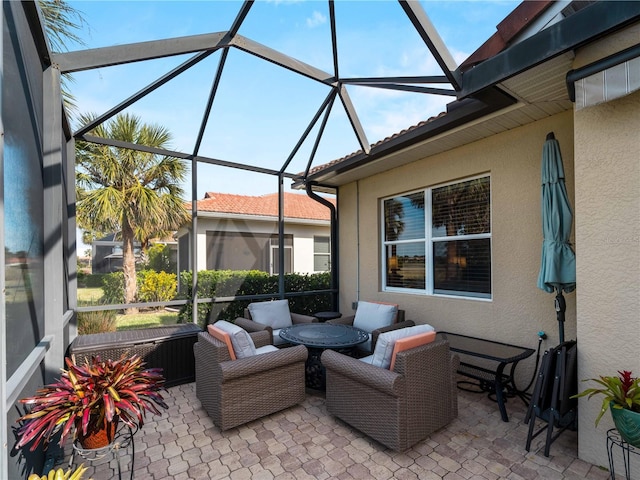 view of patio / terrace featuring outdoor lounge area and a lanai