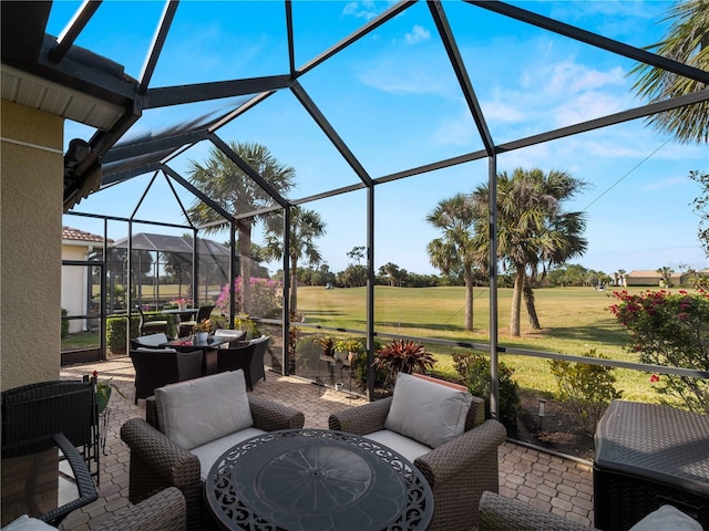 view of patio with outdoor lounge area, area for grilling, and a lanai