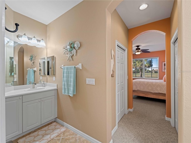 bathroom featuring vanity and ceiling fan