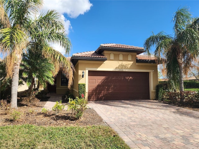 mediterranean / spanish-style house featuring a garage