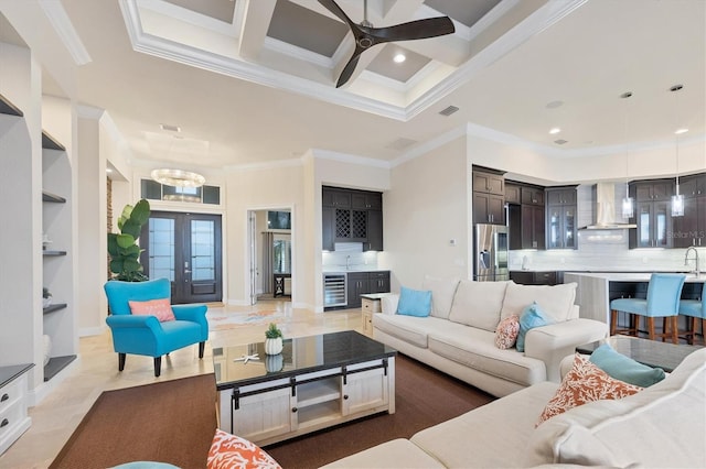 living room with coffered ceiling, french doors, beam ceiling, built in features, and wine cooler