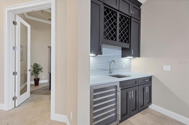 bar with sink, ornamental molding, wine cooler, and decorative backsplash