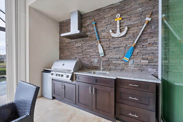 view of patio with sink, exterior kitchen, and a grill