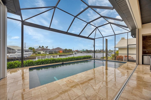 view of swimming pool featuring a lanai, a patio area, and a water view