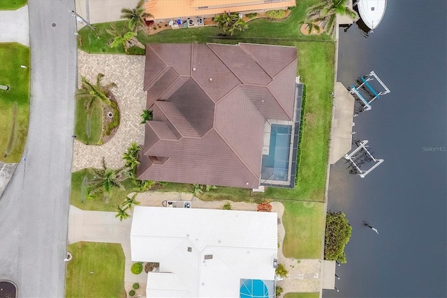 birds eye view of property with a water view