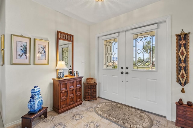 entrance foyer featuring french doors