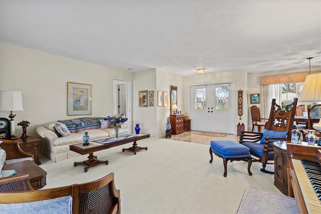 living room with light colored carpet and french doors