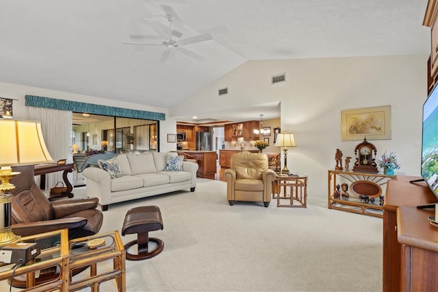 living room featuring ceiling fan, lofted ceiling, and light carpet