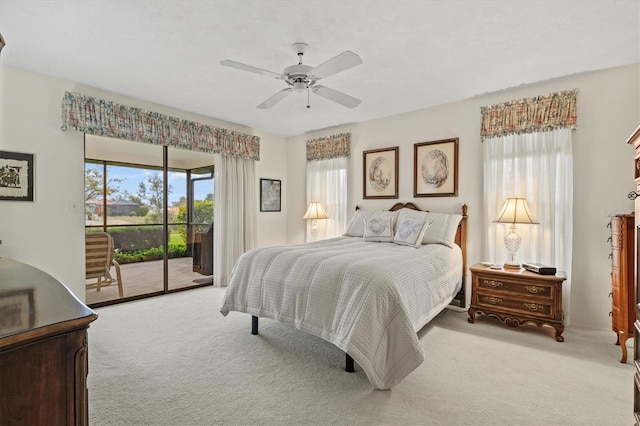 bedroom with light carpet, access to outside, and ceiling fan