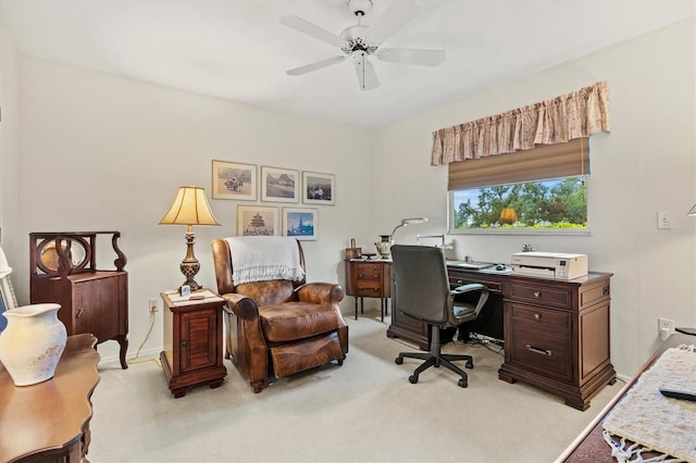 home office with light carpet and ceiling fan