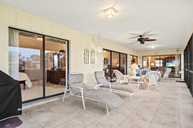 view of patio featuring ceiling fan